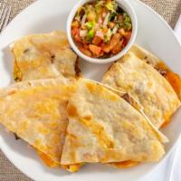 Quesadillas · Freshly pressed flour tortilla filled with your choice of beef or chicken fajita served with...
