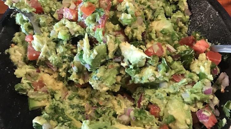 Table Guacamole · Made fresh at your table with your favorite ingredients: onion, jalapeño, pepper, tomato, cilantro, lemon, and salt.