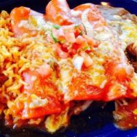 Street Enchiladas · One brisket, one al pastor and one carnitas enchiladas topped with ranchero sauce and pico d...