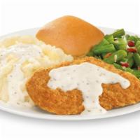 Chicken Fried Chicken Meal (Single) · One piece of chicken fried chicken drizzled with gravy (white or brown), served with two reg...
