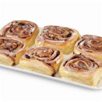 Sinnamon Roll (Half Dozen) · Six Sinnamon® rolls made with a blend of cinnamon, nuts, and raisins topped with icing.