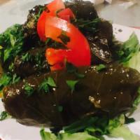 Dolma (Stuffed Grape Leaves) · Stuffed with rice, pine nuts, currants and chef spices.