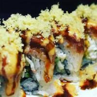 Dragon Roll · Shrimp tempura, cucumber, crab mix. Topped with freshwater eel and avocado, eel sauce, and s...