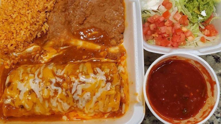 Beef Burrito · Ground beef burrito topped with enchilada sauce and cheese. Served with shredded lettuce. Sour cream, guacamole, diced tomatoes, rice and beans.