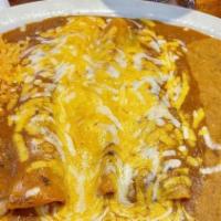 Beef Enchiladas · Three ground beef enchiladas topped with enchilada sauce and shredded jack and cheddar chees...