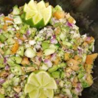 Shirazi Salad · Diced tomatoes, cucumbers, onions, lemon juice, olive oil, parsley, and mint.