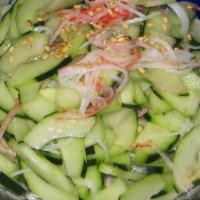 Cucumber Salad · fresh cut cucumber with ponzu sauce and sesame seeds.