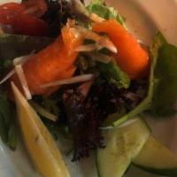 Salmon Salad · With avocado, onions, cheddar cheese, tomato.
