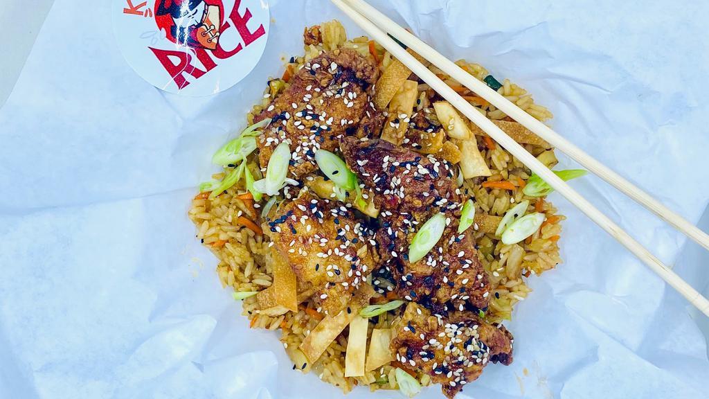Sesame Chicken Fried Rice · Fried chicken glazed with sweet sesame glaze, bell peppers, onion, carrot, cabbage.