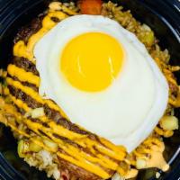 Moco Loco Fried Rice · Inspired in Hawaiian breakfast fried rice pineapple teriyaki glaze, seared spam.