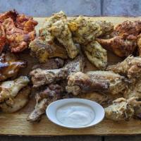 20 Smoked Wings · 20 Slow smoked, fall of the bone wings with your choice of two sides and dipping sauces