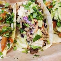 Chicken Tacos · 3 Corn Tortillas filled with Grilled Chicken, Shredded Cheese, Pico, Avocado Crema and Cilan...