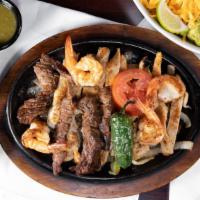 Parrilada Sonora · A combination plate with chicken, beef, and shrimp marinated and grilled, sautéed with onion...
