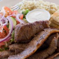 Gyro Skillet · Fajita style! Served with sautéed onions, green peppers tomatoes and rice or fries and a min...