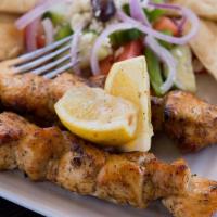Chicken Souvlaki Plate · Two skewers of marinated and grilled chicken. Served with your choice of rice or French frie...
