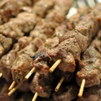 Lamb Souvlaki Plate · Two skewers of marinated and grilled lamb. Served with your choice of rice or French fries, ...