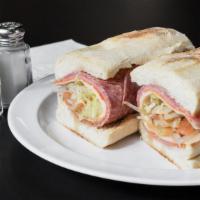 Our Famous Cold Italian Hero · Thinly sliced Genoa salami, ham, pepperoni, provolone cheese, lettuce, tomato, onion with oi...