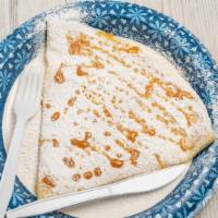 Melaburro Crepe · Apples, apple butter, cinnamon, and caramel topped with powdered sugar and caramel drizzle.