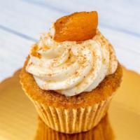 Jumbo Peach Cobbler · Moist, made from scratch, cinnamon and sugar cupcake, filled with cinnamon peaches, topped w...