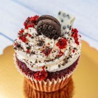 Jumbo Red Velvet Cookies & Cream · Classic Red Velvet cupcake topped with Oreo & red velvet cake crumbles and topped with a Min...