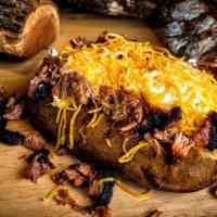Brisket Loaded Baked Potato · Giant Baked Potato loaded with butter, cheese, sour cream & chopped Brisket