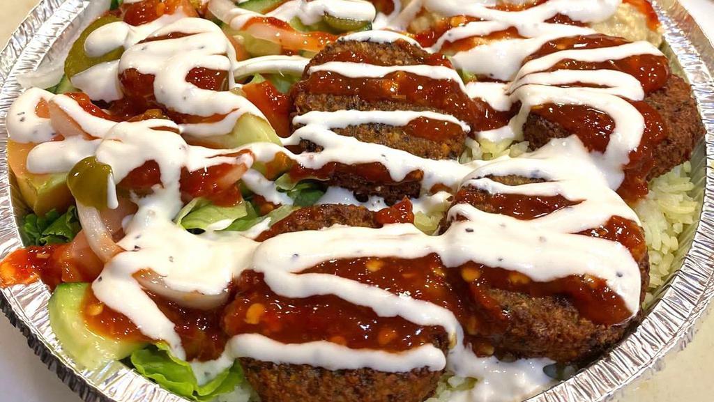Falafel Plate · Falafel patties comes with rice, hummus, veggies (lettuce, tomatoes, pickle, onion, cucumber) and pita. Pick your sauces.