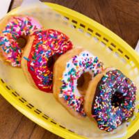 Chocolate Iced Sprinkles · Our yeast-raised do-nut hand-dipped in chocolate icing covered in sprinkles.  Choose your qu...