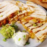 Quesadilla · One flour tortillas onions, tomatoes and a choice of ground beef, Pork , chicken, lamb, Shri...