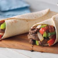  Lamb Burrito · 10-inch Flour filled tortilla with lettuce, tomato, cilantro, onions, refried or pinto beans...