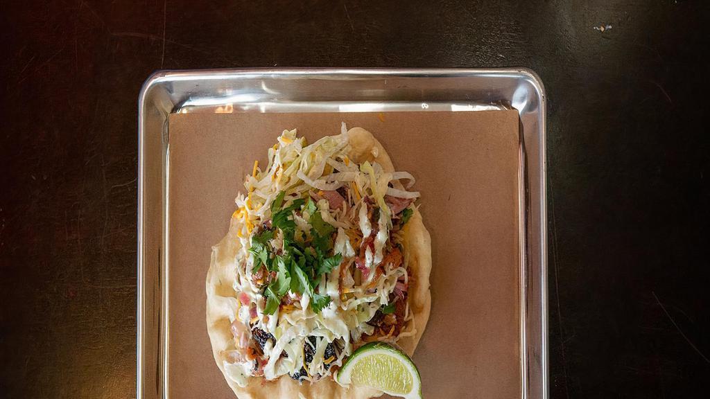Pork Belly Burnt End'S Taco · Signature Pork Belly Burnt Ends, Pico, Crema, Bbq sauce, cotija cheese on flour tortilla