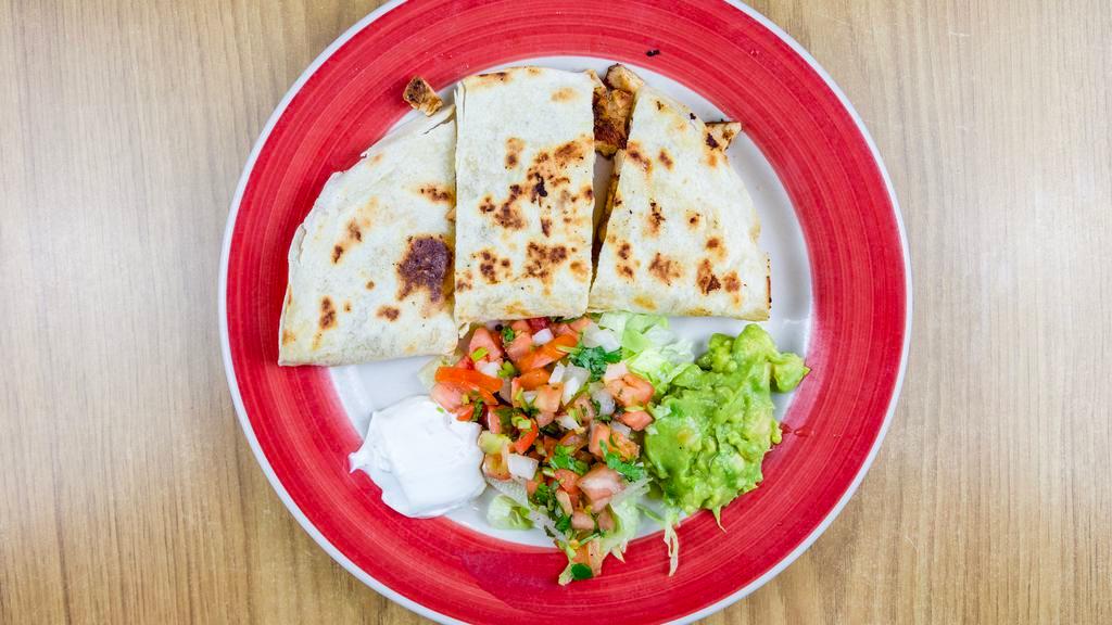Quesadillas · Your choice of beef or chicken fajita with cheese served with guacamole sour cream and pico de gallo.