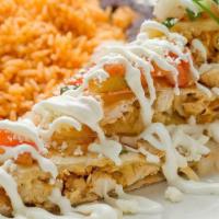 Enchiladas Mexicanas · With Mexican cheese or chicken topped with potatoes and carrots.