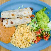 Tacos Al Carbon · Your choice of pork, beef, or chicken fajita, served with rice, beans, guacamole, and pico d...