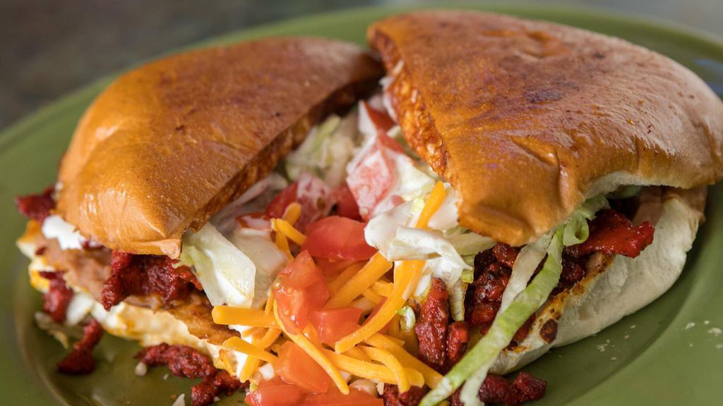 Torta · Served with your choice of meat, lettuce, onion, avocado, tomato, cheese, and sour cream.