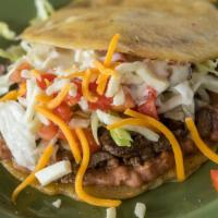 Gordita · Served with your choice of meat, lettuce, onion, tomato, cheese, and sour cream.