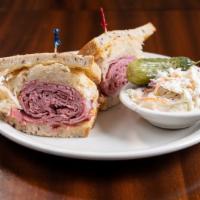 Reuben · Hot pastrami, corned beef or turkey piled high with sauerkraut, Swiss and thousand island on...