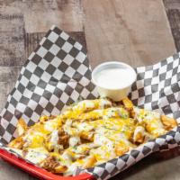 Texas Chili Cheese Fries · Served with chili, white melted and shredded cheddar cheese, bacon and blends house-made ran...