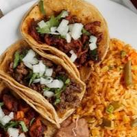 Tacos Plate · rice, beans, and choice of the meat beef, chicken, or pork.