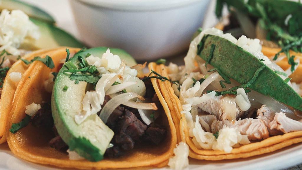 Street Tacos · Five taquitos, your choice of chicken,  Al Pastor, beef fajita or mixed, served on corn tortillas with grilled onions, cilantro, queso fresco, and avocado.