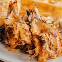 Cowboy Steak · 6 oz. grilled certified Angus beef outside skirt topped with two extra jumbo chipotle shrimp...