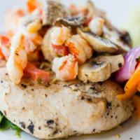 Chicken Gabriela · Grilled chicken breast served on a bed of spinach topped with field mushrooms, shrimp, crawf...