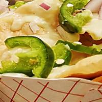 Messy Nachos · Corn tortillas, cheese sauce, red onion & fresh jalapeño