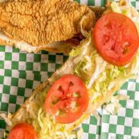 Fish Po-Boy · 2 pcs of Battered Catfish served on New Orleans  French Po-Boy Bread dressed with Mayo, Lett...