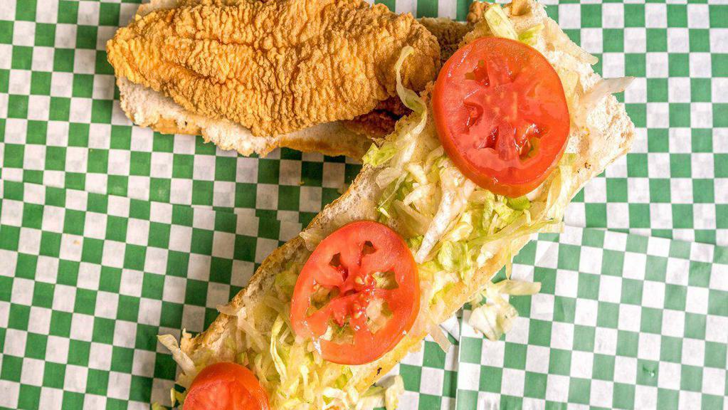 Fish Po-Boy · 2 pcs of Battered Catfish served on New Orleans  French Po-Boy Bread dressed with Mayo, Lettuce, Tomato, Pickle (optional) and Fries