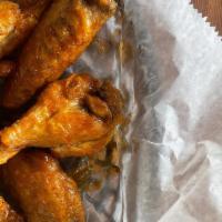 Mango Habanero Wings · 6 wings tossed in our homemade mango habanero sauce.