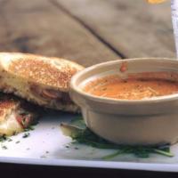 Grilled Cheese · Melted Muenster, white Cheddar & Gruyère cheeses with tomato on Texas Toast, served with a c...