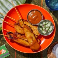 Chicken Satay · Marinated chicken skewered and grilled, and served with peanut dipping sauce.