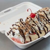 Banana Split · 3 scoops of ice cream topped with strawberry jelly, whipped cream, chocolate, and a cherry.