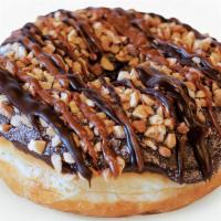 Chuckles · Raised yeast doughnut with chocolate frosting dipped in hot chocolate powder and topped with...