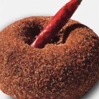 Ring Of Fire · Chocolate cake doughnut dusted in cinnamon sugar, cayenne pepper and topped with a dried red...
